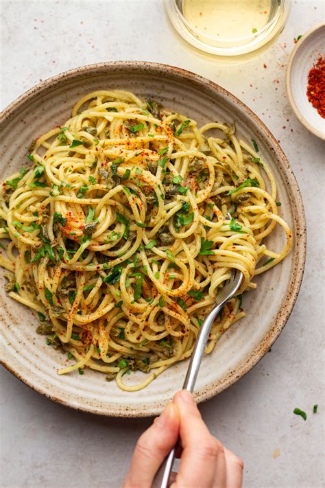 Vegan pasta. Instructions. Preheat oven to 350ºF (180ºC). Spray a large baking dish with cooking spray, and start layering your ingredients. Add uncooked pasta, lentils, onion, and red peppers, followed by minced garlic, fresh basil, dry basil, oregano, salt, and black pepper. 