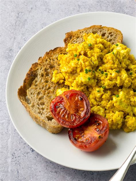 Vegan scrambled eggs. Mar 23, 2018 · Grab a pan, heat up add the olive oil and stir-fry your sliced white part of the spring onion. Now add the tofu and stir fry on medium heat. To season add the spices one by one, including black pepper, cumin, coriander, and turmeric. Stir fry the whole content so that the spices cover all the scrambled tofu evenly. 