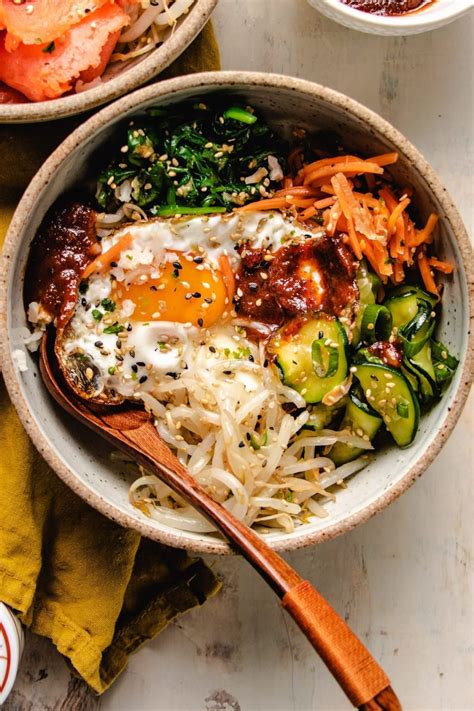 Vegetarian bibimbap. Jul 15, 2018 · When hot add the spinach and soy sauce. Stir and cook for 1 - 2 minutes just to wilt the leaves, don't overcook. Remove from heat. To assemble the bowls, divide the rice evenly among the bowls. Follow the rice with the Sweet Korean Lentils, cooked spinach, carrots, cucumber, kimchi, and the drizzle the Vegan Toast Dipping Sauce in the middle of ... 