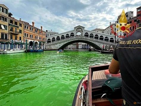 Venice's waters turn fluorescent green near Rialto Bridge