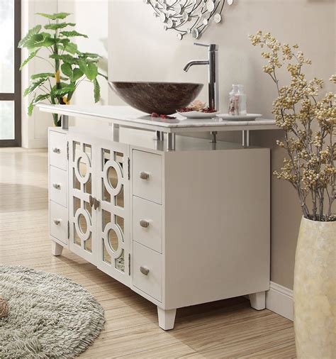 Vessel sink and vanity. Style, function, and versatility, this vessel sink TB Andreka series will be the cornerstone of your bathroom décor. This 42-inch vessel sink Andrea offers 2 side drawers and one storage compartment, providing ample storage space for your essentials. Featuring clean lines, the TB embraces a transitional aesthetic that is timeless and pure. The trendy … 