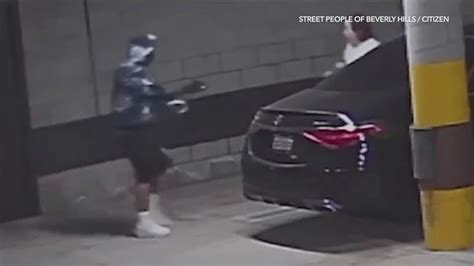 Video: Woman robbed at gunpoint in Hancock Park parking garage