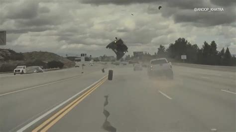 Video shows car launched into the air by runaway tire in Los Angeles