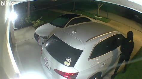 Video shows man attempting to break into car, SUV outside Weston home