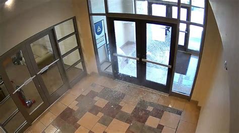 Video shows suspect firing shots through apartment door
