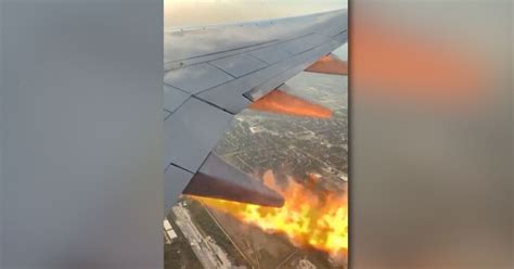 Videos show flames from engine of plane that returned to Houston airport after takeoff