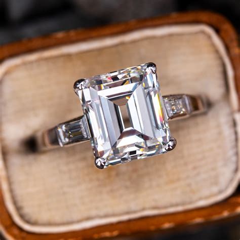 Vintage emerald cut engagement rings. Sku 18085w14. This sophisticated engagement ring features six beautiful emerald cut side diamonds set in classic, tailored shared prongs setting. The center stone is set in a four prong basket with claw tips. Product Details. 