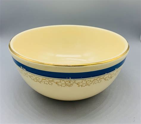 Up for auction is this vintage Homer Laughin China Company, small mixing bowl. It is the orange tree design. It is 7" across and 3 1/4" deep and the color is turquoise. Bowl has some minor flaws in the finish done during the manufacturing process and raised tree design has some wear from years of handling and use, but overall it is in great .... 