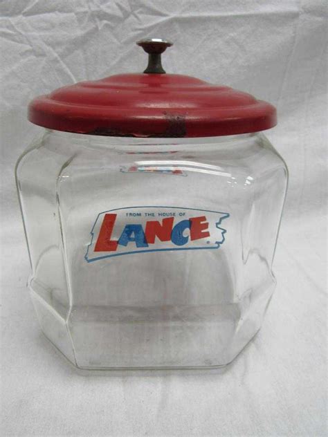 Vintage lance jars. This set is complete and in excellent condition. It is an Original Full Store Candy Display. Includes 6 Lance Snack Jars w/ metal lids & Display Stand. Display stand measures 23"w x 33"h x 19"d. It has the original metal "Lance" tag on the front. Solid and sturdy Metal Frame with 2 shelves. Each shelf area has 2 dividers to keep the jars seprated. 
