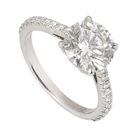 Vintage tiffany engagement ring. To ensure maximum beauty, Tiffany Three Stone engagement rings are expertly crafted with three precisely cut stones set in a sleek platinum band, allowing the round brilliant diamond to take center stage. Featuring a triple excellent cut diamond—the highest grade in the industry—this engagement ring shines as brightly as your partnership. 