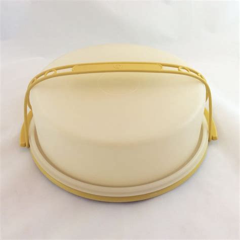 Vintage Tupperware 12" Round Large Harvest Gold Cake Carrier Taker Keeper with Handle. Visit the Tupperware Store. 3.9 17 ratings. $6550. Only 1 left in stock - order soon. Brand. Tupperware. Color. Gold.