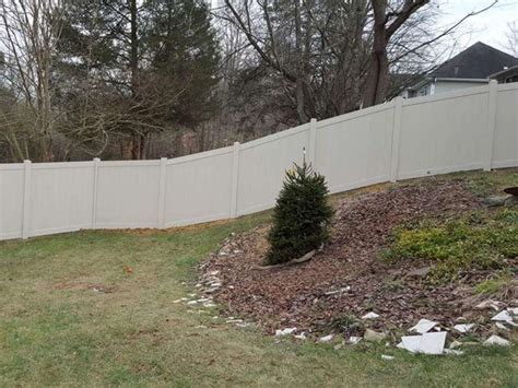 Vinyl fence panels installation.  From preparing the ground and setting the pos...
