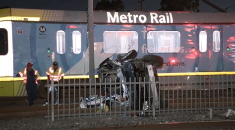 Violent crash with Metro Blue Line train overturns car