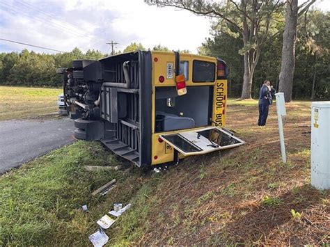 Virginia school bus driver and 12 children hurt after bus overturns, officials say
