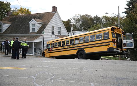 WATCH: Driver cited for negligent operation after school bus crashes into utility pole, home in Fall River
