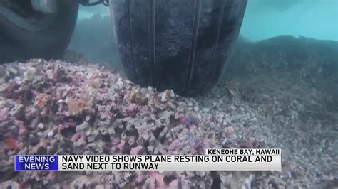 WATCH: Underwater video shows stuck Navy plane's tires touching coral reef