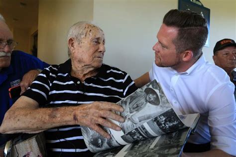 WWII photographer honored for 100 years of service to country, community