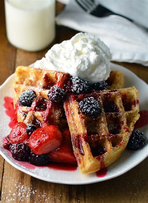 Waffles and berries. In a large bowl, whisk together the flour, brown sugar, baking powder, baking soda, salt, and cinnamon. In a separate bowl, whisk together the milk, eggs, oil, and vanilla. Pour the wet ingredients into the bowl with the dry ingredients and whisk just until combined. Some lumps are fine. Gently fold in the blueberries. 