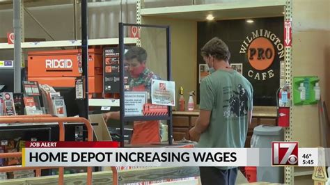 A customer enters a Home Depot store on August 16, 2022 in San Rafael, California. Home Depot on Tuesday said it will spend an additional $1 billion to give its hourly employees a raise, as .... 