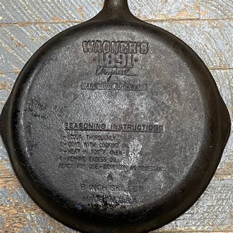 Cast Iron Wagner 1891 Fat Free Fryer These were made between 1980 and late 1990s to commemorate Wagners 100th anniversary. The bottom is marked Wagners. 1891. Original. Cast Iron Cookware. Below that are seasoning instructions. It measures 11 3/8 in diameter and is about 2 deep. Its been. 