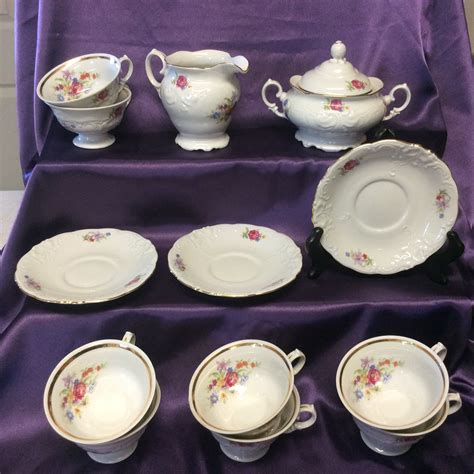 Vintage WALBRZYCH Demitasee Coffee / Tea Service 17 pieces Bone China Made in Poland This is a lovely, mint condition white china demitasse set in a flower pattern in pale pink and green. This set includes the covered pot, creamer, covered sugar bowl and 6 cups with saucers.