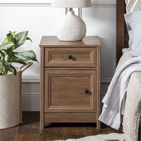 Make an update to your interior space with this Walker Edison Sloane 2-drawer nightstand. For convenience, it ships ready-to-assemble. Cutout handles of walnut-stained solid pine wood create decorative charm. . 