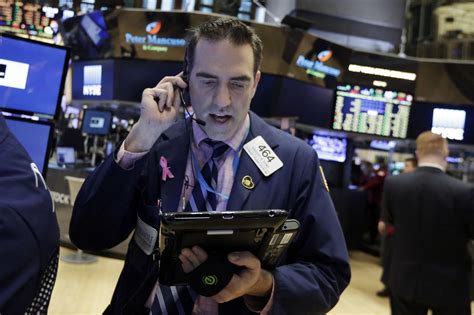 Wall Street wavers in the early going ahead of earnings news