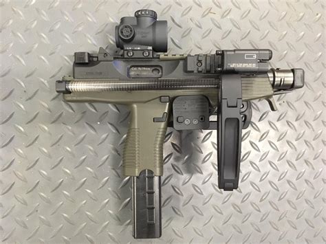The Canik TP9 SF Elite Combat is the result of years of improvements made to TP9 models. It remains a versatile weapon that is praised for its performance as a defense weapon and one for sport. It features an improved Canik Enhanced trigger, ambidextrous slide release, as well as under- and over-rails for adding accessories to your firearm..