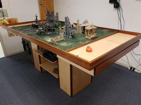 Warhammer tabletop. Nov 6, 2017 · In this article I will demonstrate how to build a 4’X6′ folding table top, terrain mat, and three-dimensional terrain set for around $50 and with minimal modelling skills required. Table of Contents hide. 1) Item 1 – Gaming Mat: $10-$14. 1.1) Tie Dye Pattern Fabric. 2) Item 2 – The Wargaming Table Top: $24-$39. 