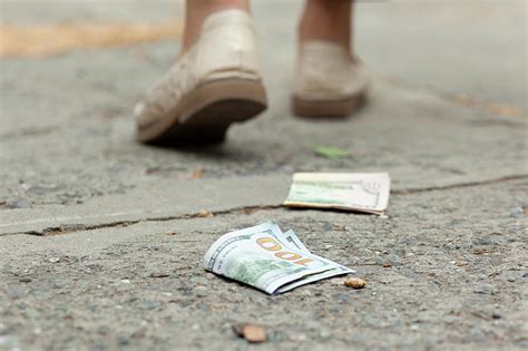 Warning: Picking up folded money could be dangerous