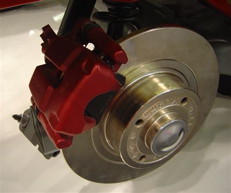 Warped brake rotor. Place the dial indicator needle against the rotor. Next, find the lowest spot on the brake rotor by rotating it slowly a full 360 degrees circle. Align the zero mark on the adjustable bezel with the lowest spot on the brake rotor. Rotate the rotor 360 degrees and notice the highest runout value. 