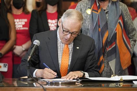 Washington Gov. Jay Inslee signs bills meant to prevent gun violence; ban sales of dozens of semi-automatic rifles