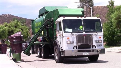 Welcome to the Waste Management Family! Cart Information: Trash- Burgundy Cart Recycle- Gray Cart Green Waste- Green Cart No household hazardous waste. Please see reverse for list of Yard waste such as leaves and acceptable recyclables. grass clippings..