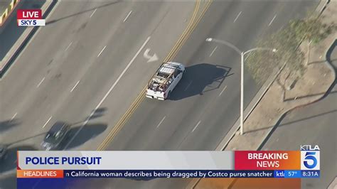 Watch live: Los Angeles police officers pursue carjacking suspect