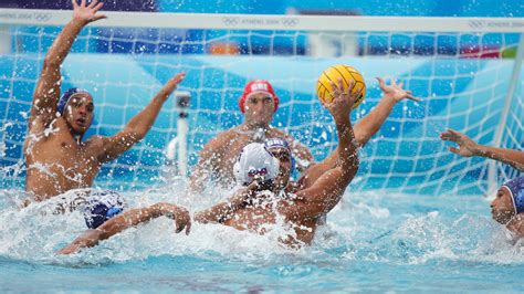 Water polo player fighting to keep hand after crash