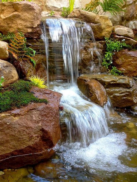 Waterfall backyard. Ever wondered what's involved in building a backyard water feature? It's a lot of work, but worth it. Exmark knows that there's more to your backyard than ju... 