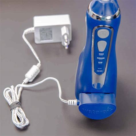 Waterpik water flosser charger. This model comes with 3 tips, 2 pressure settings, and 3 AA batteries. Waterpik ® is the #1 recommended water flosser brand, clinically proven and accepted by the American Dental Association (ADA). Removes up to 99.9% of plaque from treated areas and is up to 50% more effective for improving gum health vs. string floss. 
