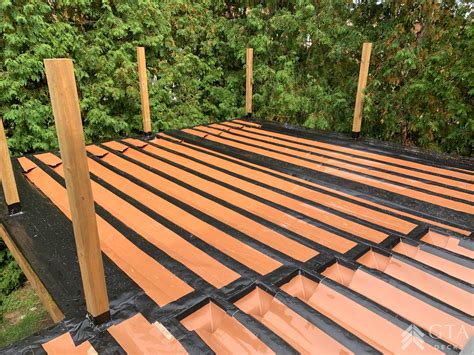Waterproof deck. After a 30-day period, pour some water on your deck. If it beads up, the wood is still too wet to seal. If the water is absorbed, it’s ready to seal. Be sure to apply sealant … 