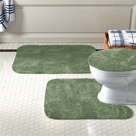 This set consists of 3 pieces including a bath mat, toilet contour mat, and toilet cover, which is designed to fit a round cover or an elongated toilet seat. Material: Polyester; Pieces Included: 1 bath mat, 1 toilet contour mat and 1 toilet cover; Overall Product Weight: 2.5lb. Product Care - OLD: Air dry, Machine Washable on low. 