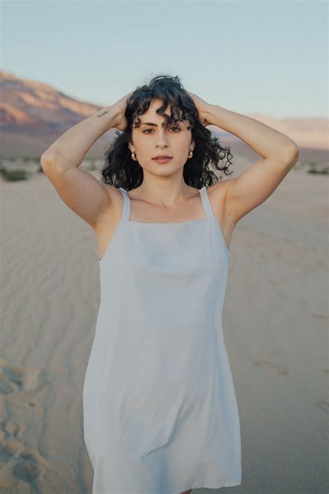 Wayre. The perfect top for travel. Button front tank crop top with elasticated back hem, biodegradable buttons, and zipper pocket top. Apparel for the modern traveler, sustainably made. Meet the wayre travel collection. 