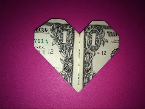 Ways to fold dollar bills. Fold the left edge along the dashed line as shown. Once it looks like the image above, flip the dollar bill to the other side. Fold the dollar bill downwards in half. Fold the top layer only. Tuck in that extra piece inside the heart to perfect the heart shape. It now looks like a paper heart, but the sides are pointy. 