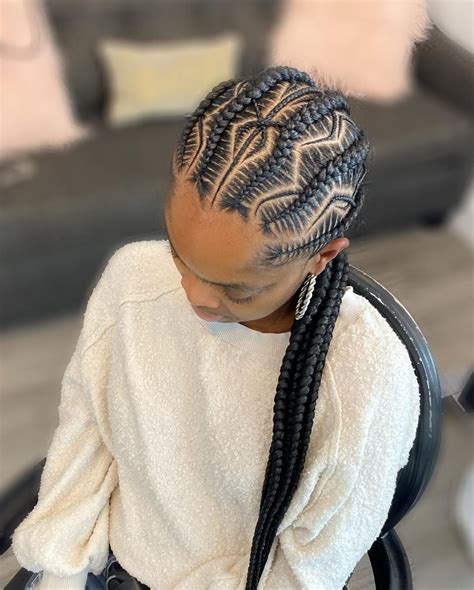 3. Twist Braid Mohawk. By simply tossing on some extra height down the middle, you can create a fierce look just like this. The look features a blend of cornrows around the sides of the scalp, with heightened box braids that make a definitive Mohawk. It’s a stylish ‘do reserved for the fiercest women. 4.. 