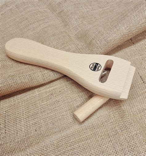 Webbing stretcher tool.  Also known as a web stretcher, web strainer, slotte...