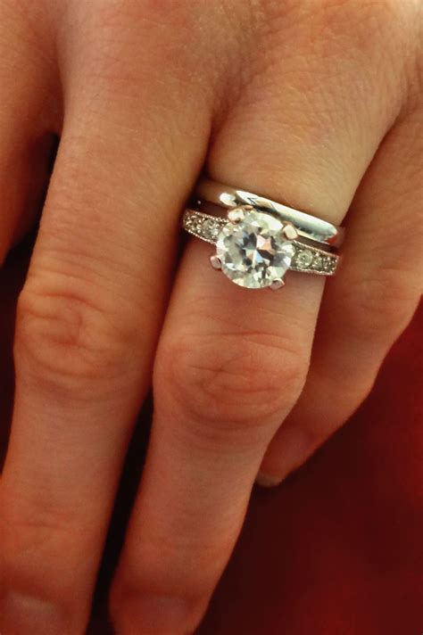 Wedding band and engagement ring. One simple solution to keeping the engagement ring and wedding bands together is to purchase an insert ring instead of a wedding band. An insert ring is essentially two spaced-out wedding bands that are connected on the bottom. The engagement ring is then slid into the gap between the two bands securely. Assuming the ring … 