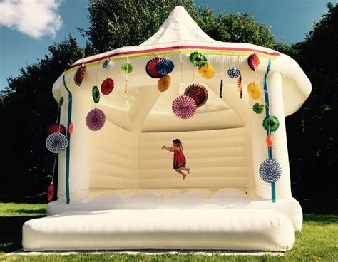 Wedding bounce house. The Wedding Bounce House is custom-designed for stability and steady rental usage. Including bright White coloring and has optional flowers and curtains on the Bounce House Inflatable. It is the perfect inflatable to emphasize for all occasions (and rents well for either boys and girls). The Wedding Bounce House follows ASTM guidelines and is ... 
