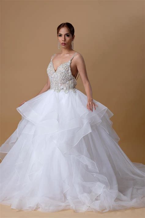 Wedding gown rental. White One PRONOVIAS is a family firm that began life in 'El Suizo', a prestigious Barcelona store founded by Alberto Palatchi Bienveniste in 1922 that ... 