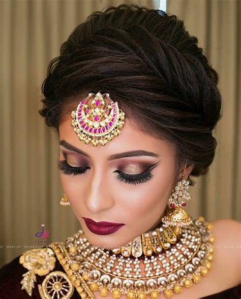 Wedding makeup hairstyle. Brides love the black shadow idea on glitter eyelids, preferably brown. Pair this look with matte flushed cheeks and glossy pink lips to create a timeless look. You may also wear HD makeup blended … 
