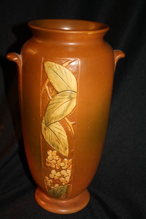 Weller Vintage Pottery Patra Handled Vase, Shape 23, 9 3/4" At almost 10" high, this hard to find vase is one of the largest in the Weller Patra pattern. Distinctive orange peel textured body with smooth green accents and multicolored pleated petals. Weller produced the Patra line from the late 1920s-1933. - No chips, cracks or repairs.. 
