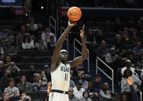 West Virginia forward Akok Akok hospitalized after collapsing on court during exhibition