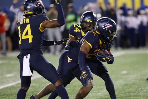 West Virginia gets strong rushing efforts from Jahiem White and CJ Donaldson in a 37-7 win over BYU